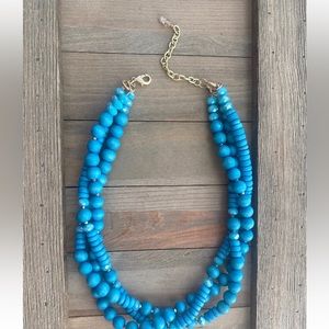 Three strand blue wood beaded necklace